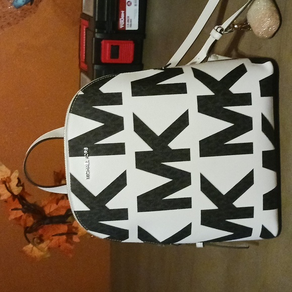 Michael kors purse backpack, white leather, with black MK on it. - Picture 2 of 4